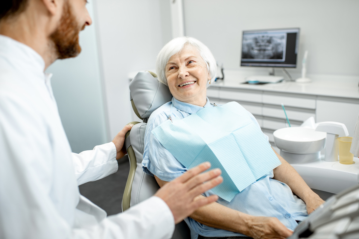 Elder woman during the consultation with dentist