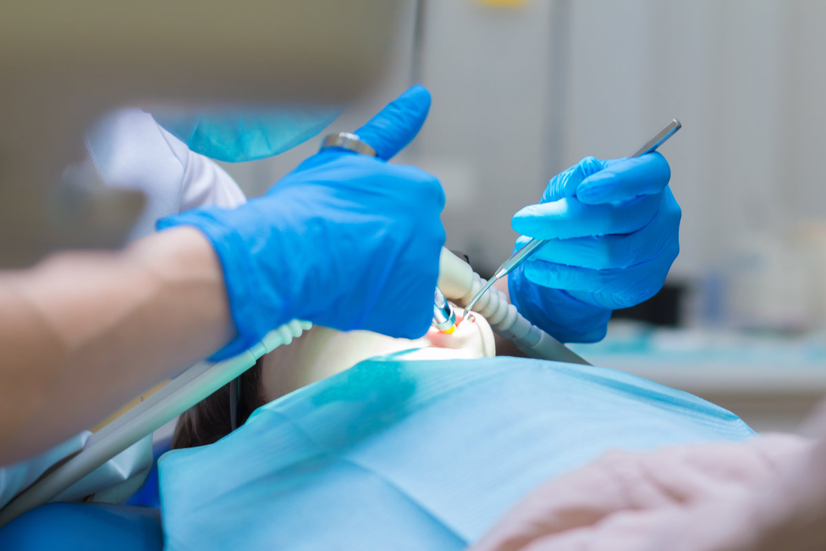 Dentistry. Girl getting Inhalation Sedation while teeth treatment at dental clinic. Teeth treatment.